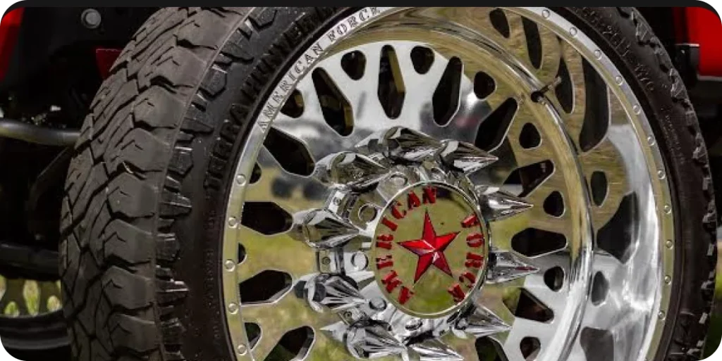 Close-up view of a custom chrome truck wheel with a red star and "American Force" prominently branded around the center.