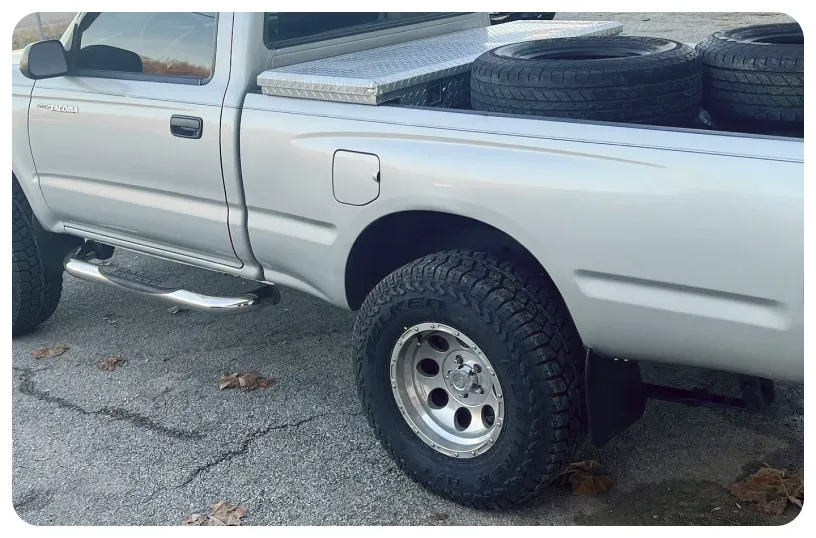 a truck with tires in the back